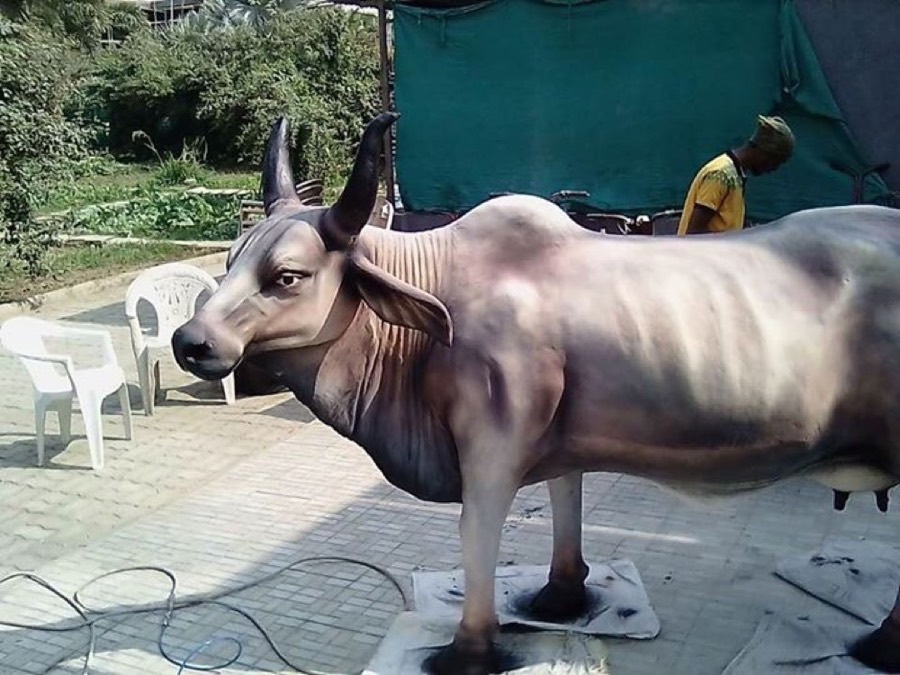 Life-size paper mache cow sculpture by Neelu Patel