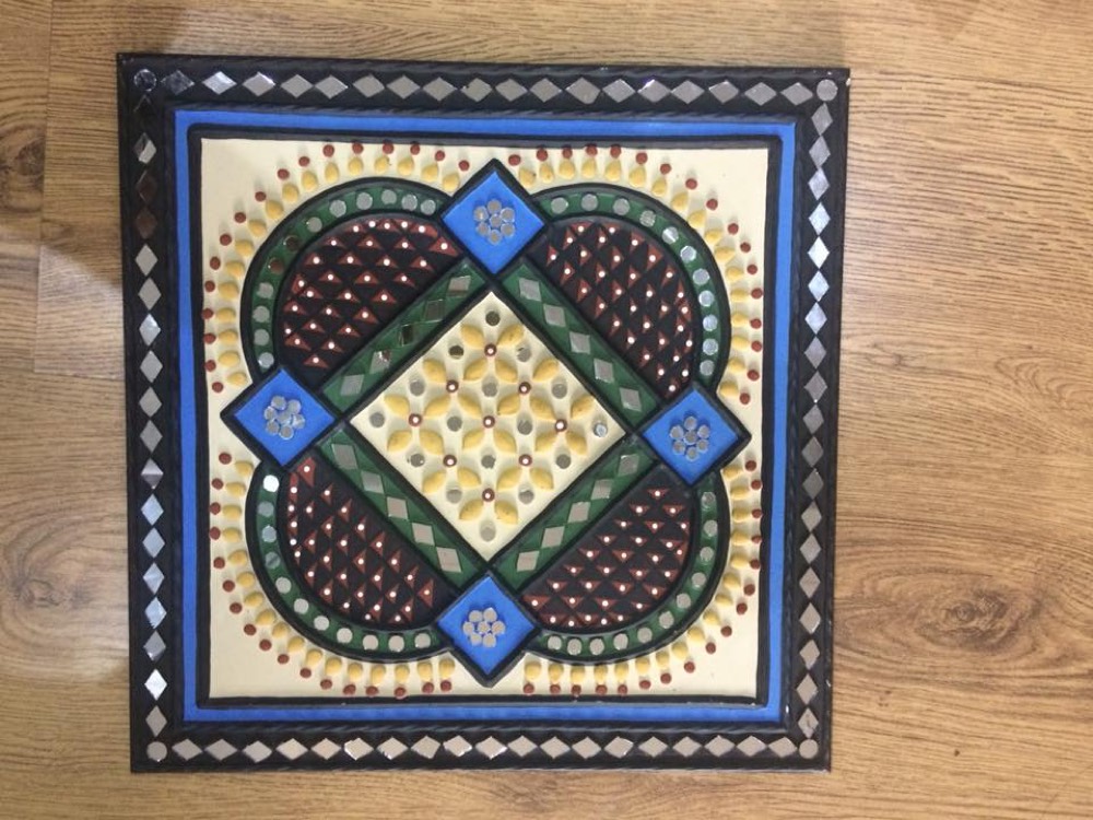 Black ,yellow and blue design mud art