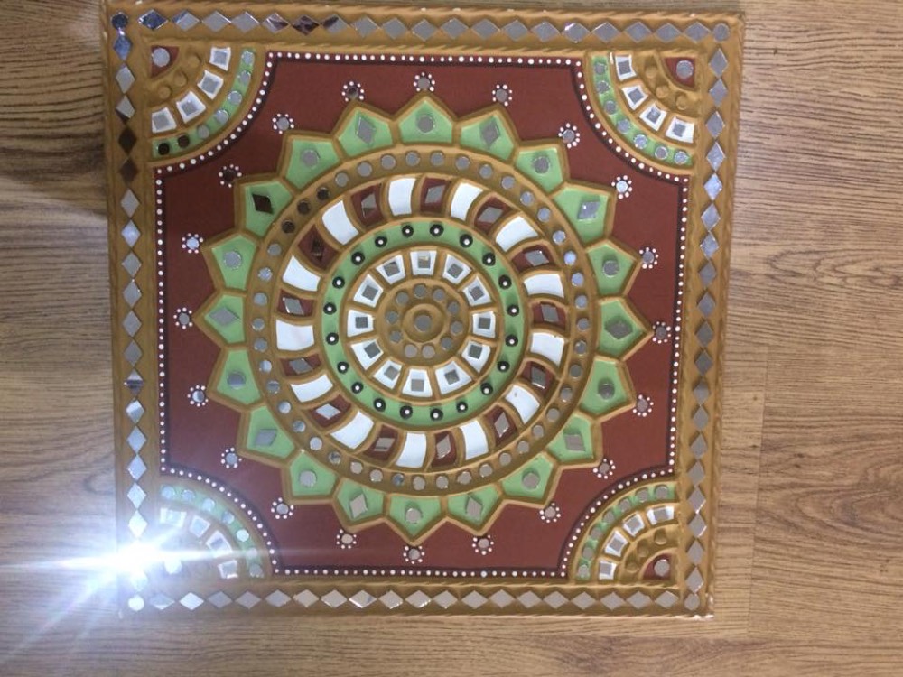 Green mud art with red and yellow color design
