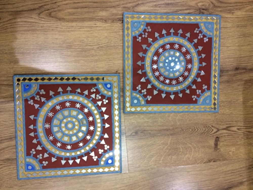 Red mud art with blue design
