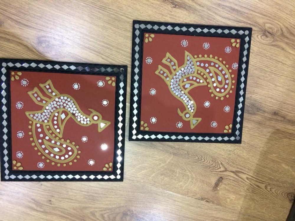Red peacock design mud art