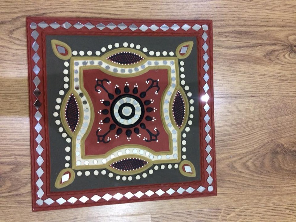 Square mud art with red design