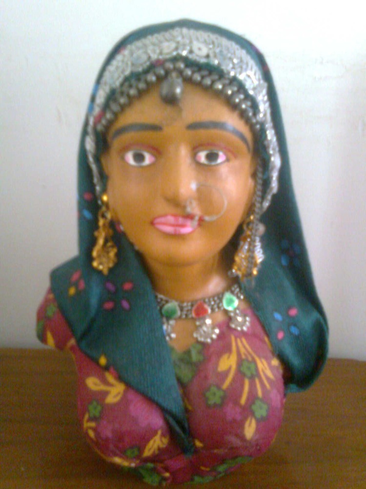 village women with blue and pink weare